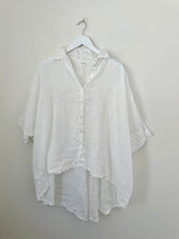 Load image into Gallery viewer, White button-up shirt on a hanger against a plain background
