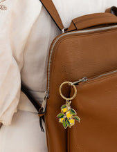 Load image into Gallery viewer, Brown leather bag with a keychain featuring lemons