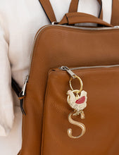 Load image into Gallery viewer, Brown leather bag with a decorative keychain featuring a bird design.