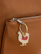 Load image into Gallery viewer, Keychain with rooster design attached to a brown leather bag