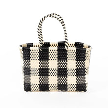 Load image into Gallery viewer, Black and white striped woven handbag on a white background