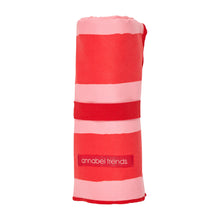 Load image into Gallery viewer, Picture of red and pink striped sand-free towel rolled up on a white background.